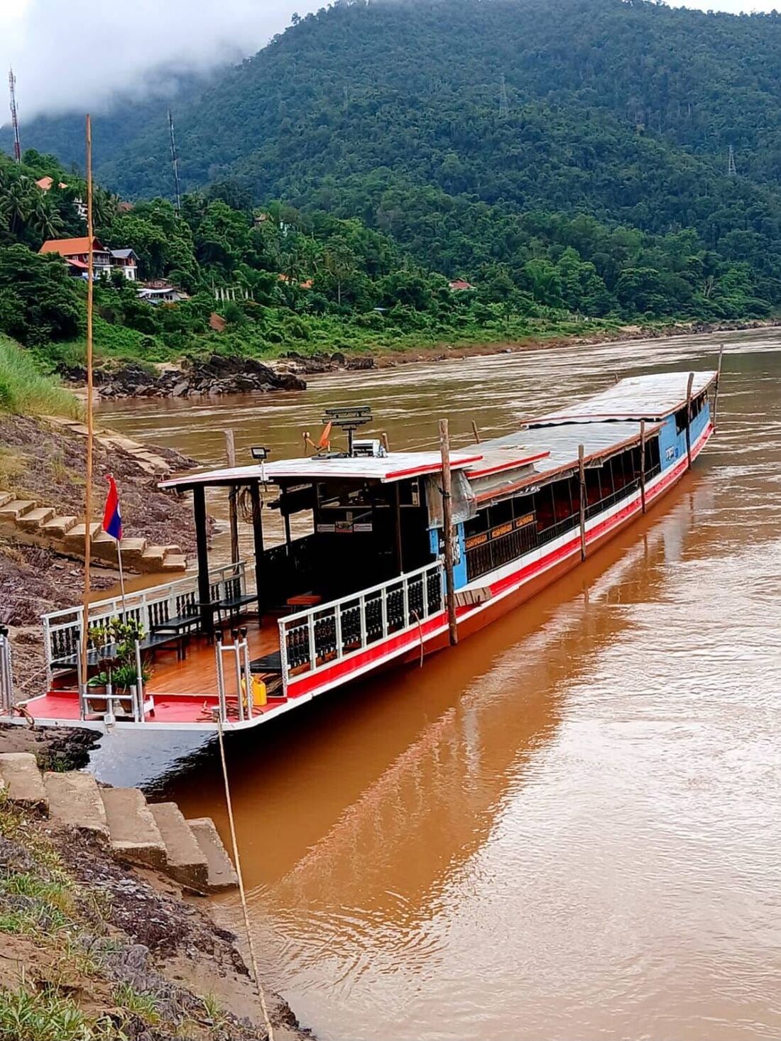The Mekong slow boat along the riverbank in Laos