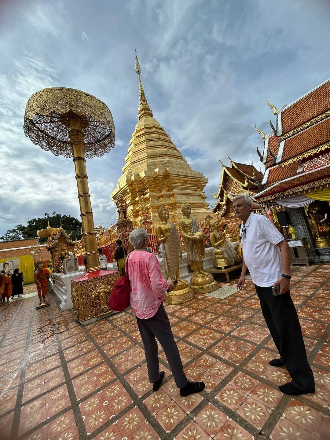 Guests at the golden chedi of Doi Suthep