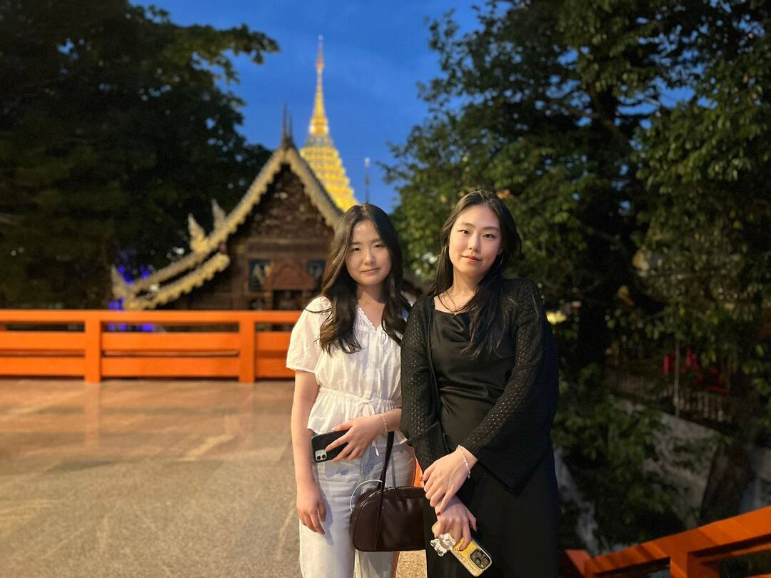 Guests at the temple gate at dusk